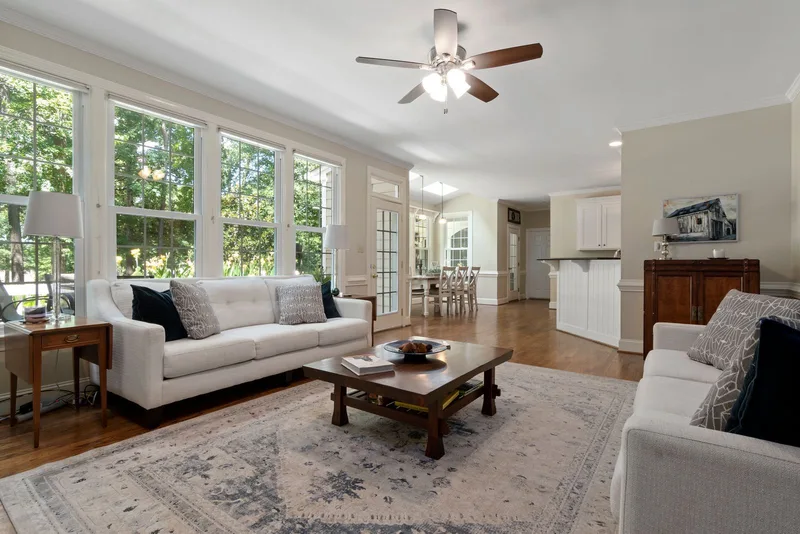 Interior inspiration: a bright living room with finished walls and wood flooring; stock photograph